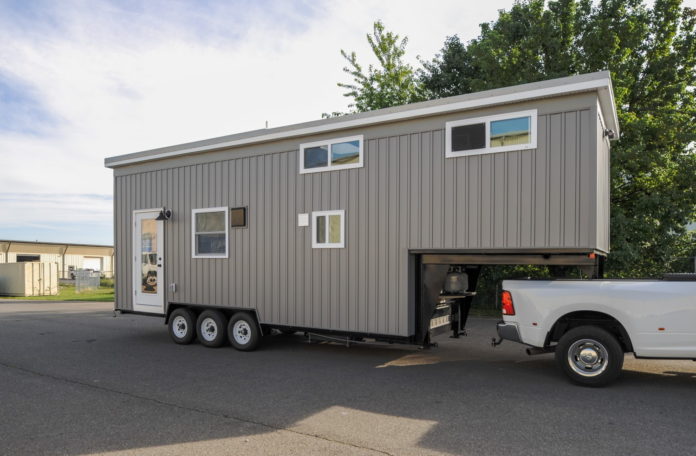 Fresh Gooseneck Tiny House Reveals a Smart Two-Bedroom Layout With a Fireplace