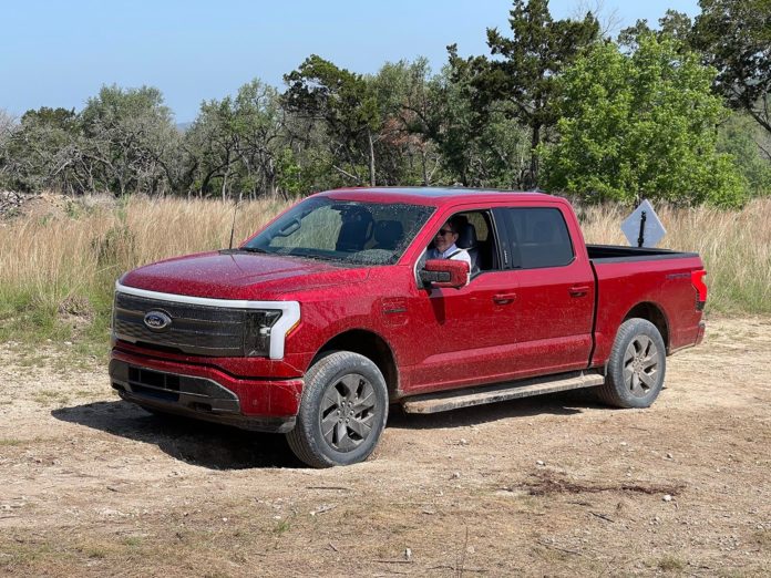 2022 Ford F-150 Lightning - muddy on trail