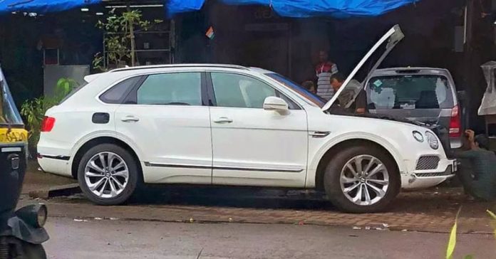 Bentley Bentayga at a roadside garage