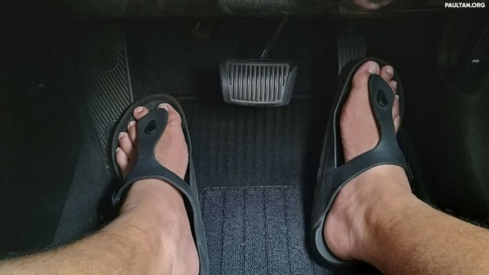 Can you drive a car in Malaysia wearing slippers?