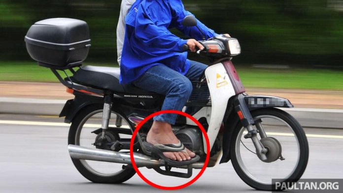 Illegal to ride a motorcycle in Malaysia with slippers?