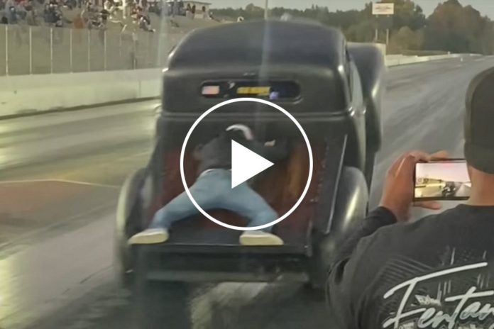 Watch: Man Goes For A Ride-Along On Drag Racing Truck's Bed