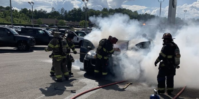 Crews respond to fire at car dealership