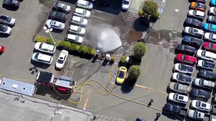 Firefighters work electric vehicle fire at Edmonds car dealership