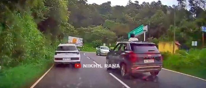 girl out of sunroof in Creta